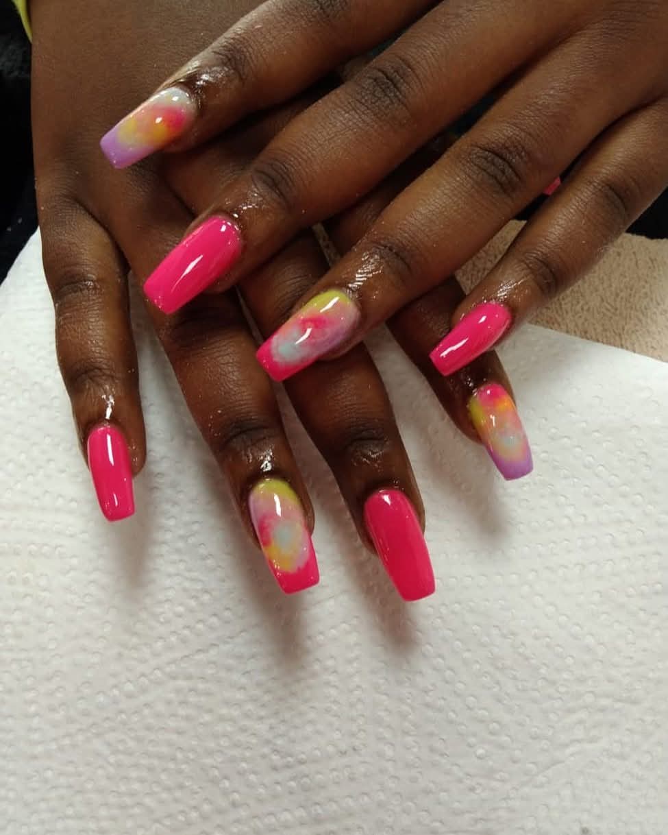 Hot pink acrylic nails with hand-painted tie-dye accent art